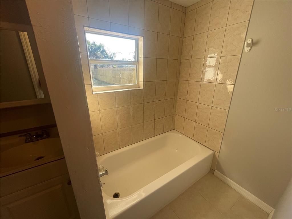 6746 Old Main Street New Port Richey, FL 34653 - Photo 21 of 39 a bathroom with a tub