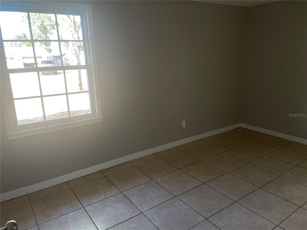 6746 Old Main Street New Port Richey, FL 34653 - Photo 23 of 39 an empty room with a window