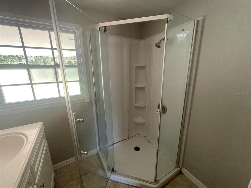 6746 Old Main Street New Port Richey, FL 34653 - Photo 25 of 39 a bathroom with a shower and a sink