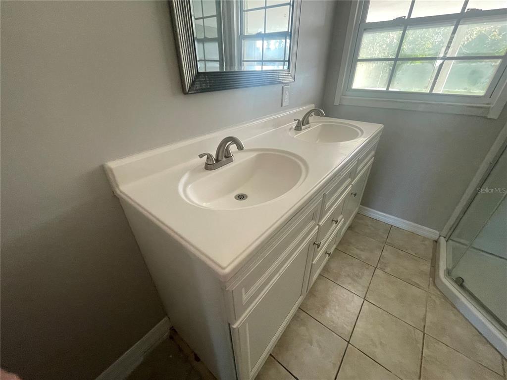 6746 Old Main Street New Port Richey, FL 34653 - Photo 27 of 39 a bathroom with a sink and a window