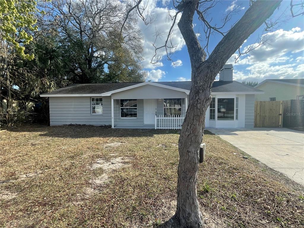 6746 Old Main Street New Port Richey, FL 34653 - Photo 3 of 39 a front view of house with yard