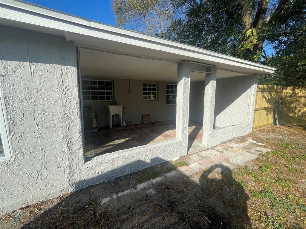 6746 Old Main Street New Port Richey, FL 34653 - Photo 32 of 39 a front view of a house with a yard