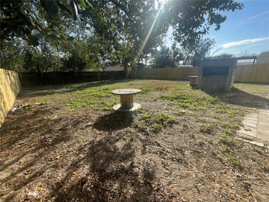 6746 Old Main Street New Port Richey, FL 34653 - Photo 34 of 39 a view of a backyard with large trees