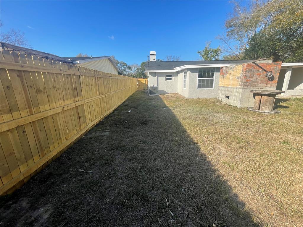 6746 Old Main Street New Port Richey, FL 34653 - Photo 39 of 39 a view of a house with a backyard