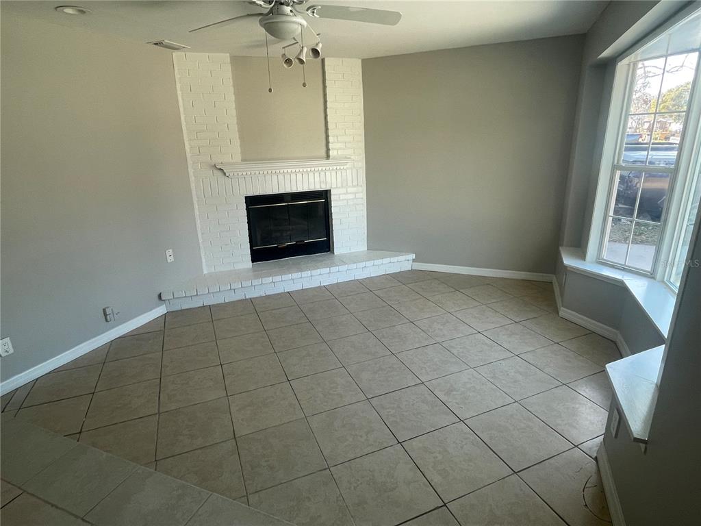 6746 Old Main Street New Port Richey, FL 34653 - Photo 7 of 39 an empty room with windows