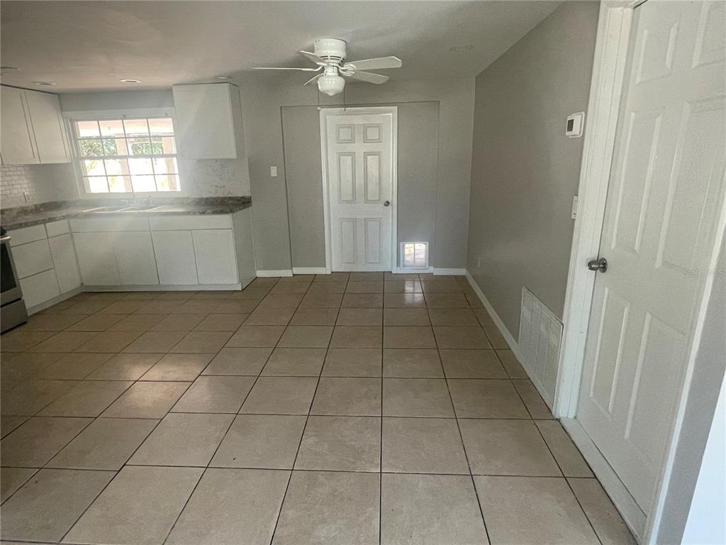 6746 Old Main Street New Port Richey, FL 34653 - Photo 9 of 39 a view of a kitchen with an empty space and a window