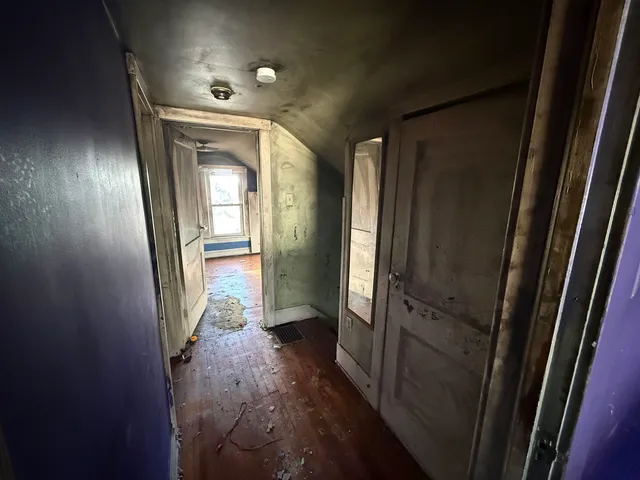 a bathroom with a tub shower vanity and a sink