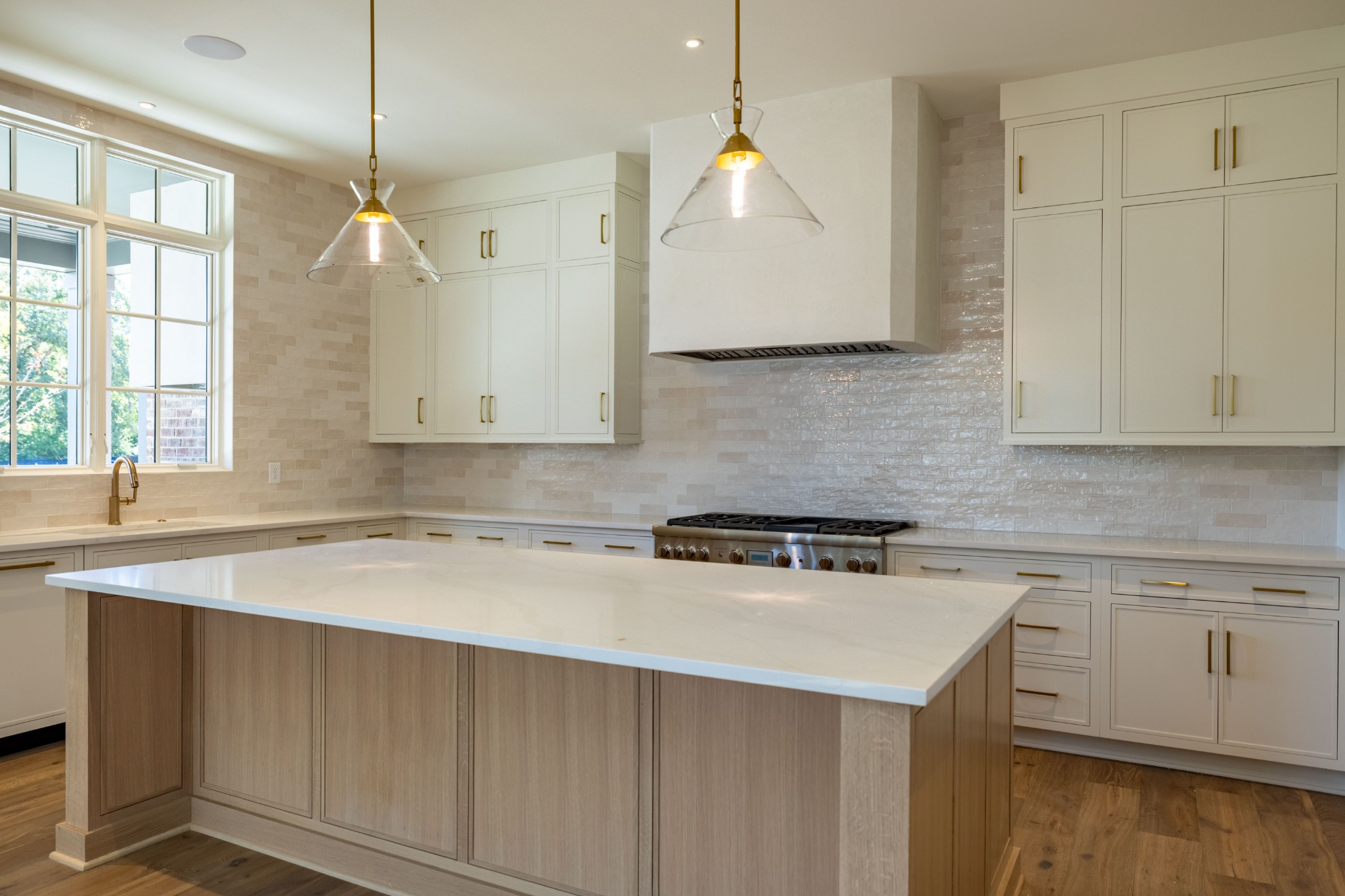 7017 Kinderhook Road Nashville, TN 37221 - Photo 12 of 43 a kitchen that has a sink a stove and cabinets