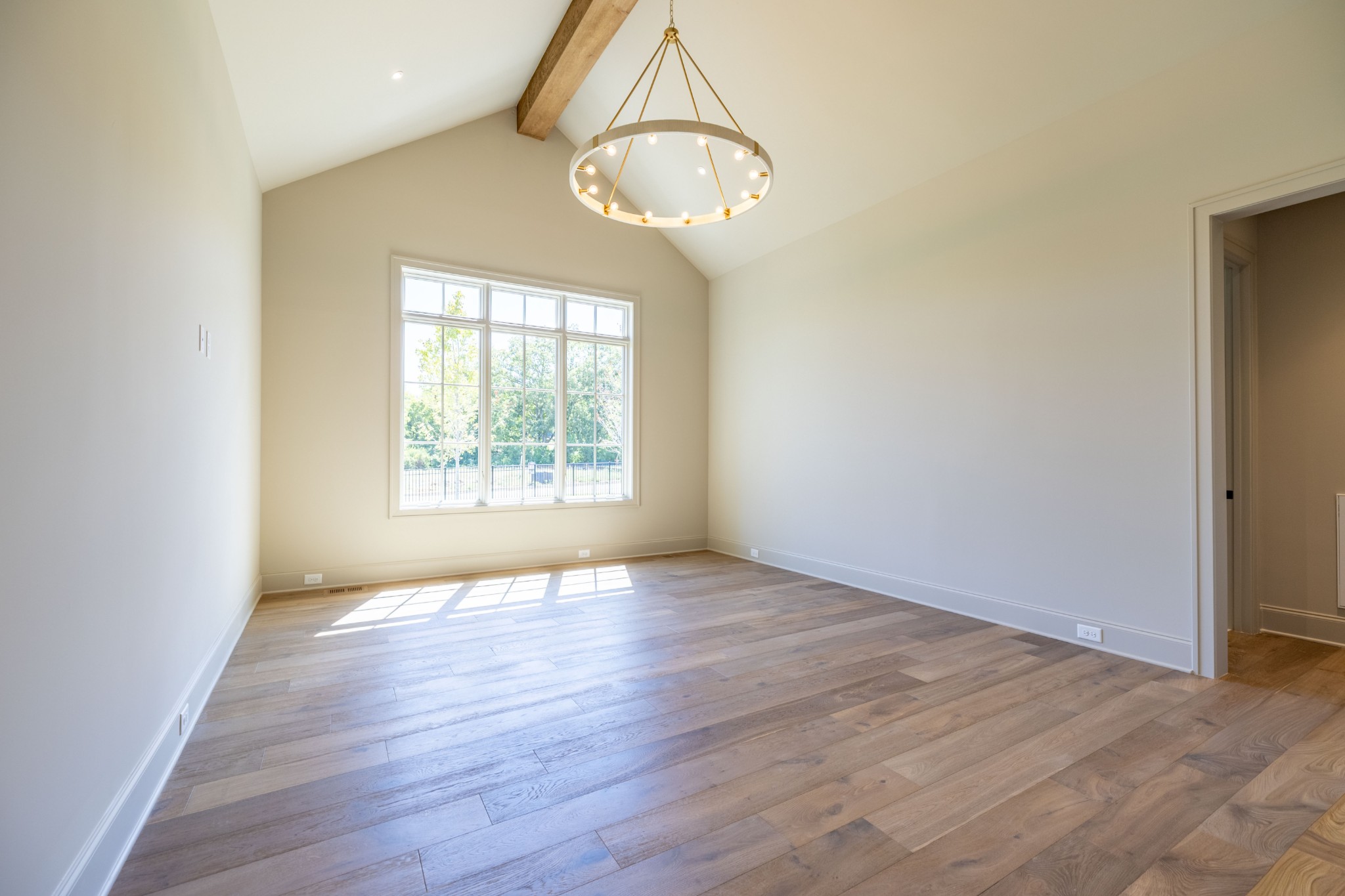 7017 Kinderhook Road Nashville, TN 37221 - Photo 19 of 43 an empty room with wooden floor mirror and windows