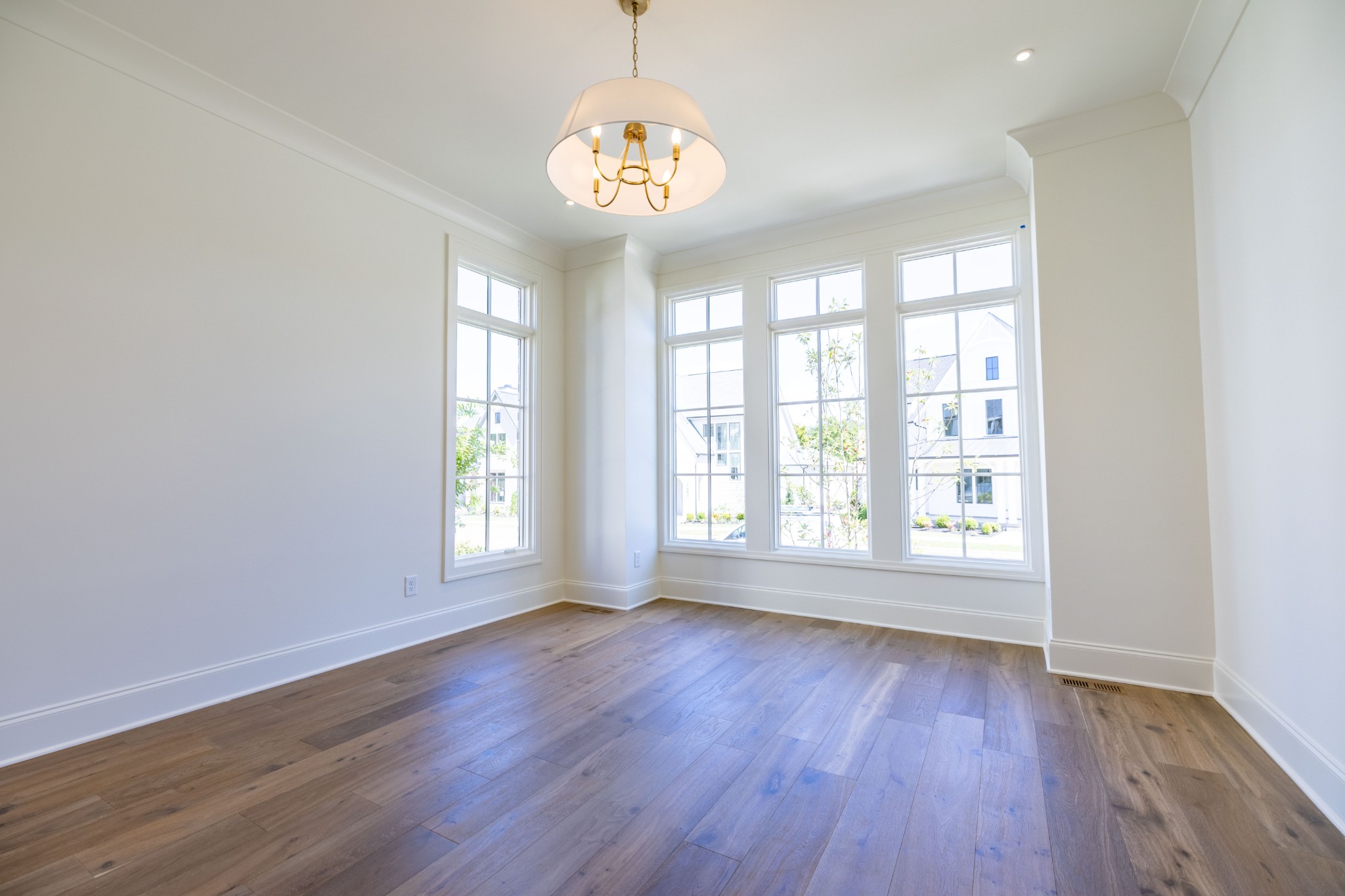 7017 Kinderhook Road Nashville, TN 37221 - Photo 23 of 43 an empty room with wooden floor and windows