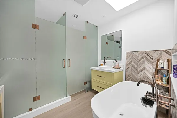 a bedroom with furniture and a chandelier