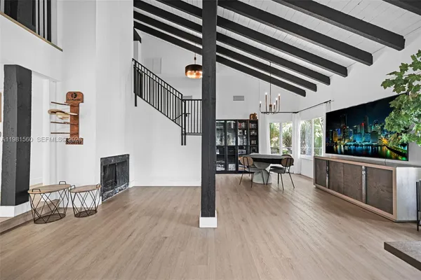 a view of dining room with furniture wooden floor and window