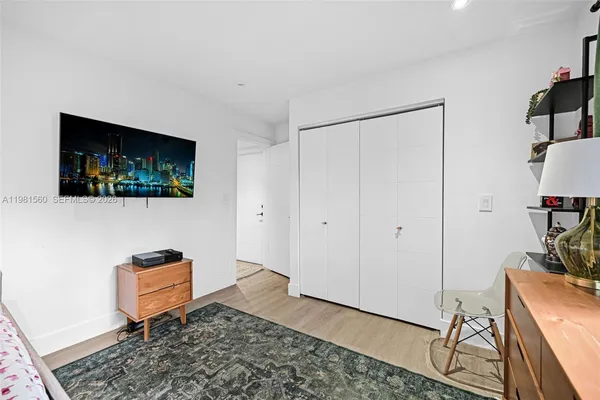 a bedroom with a bed and a couch