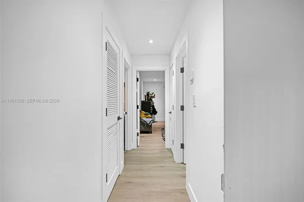 a view of a garage with storage and a ceiling fan