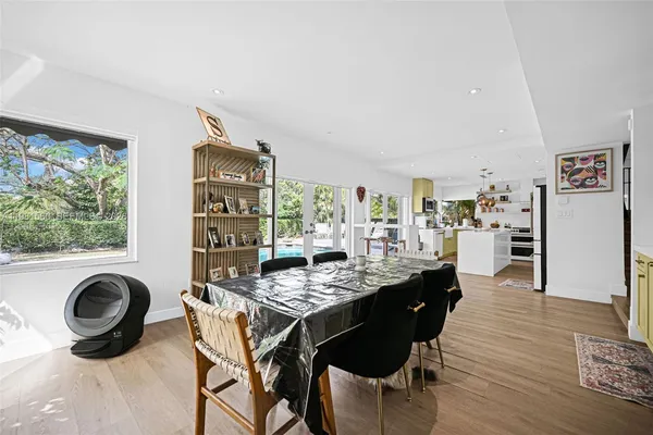a kitchen with stainless steel appliances a stove a sink and cabinets