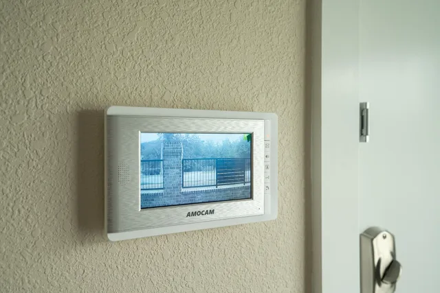 a kitchen with stainless steel appliances granite countertop a refrigerator a stove sink and microwave