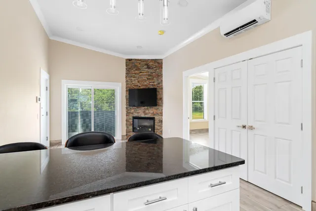 a bathroom with a granite countertop sink toilet and a mirror