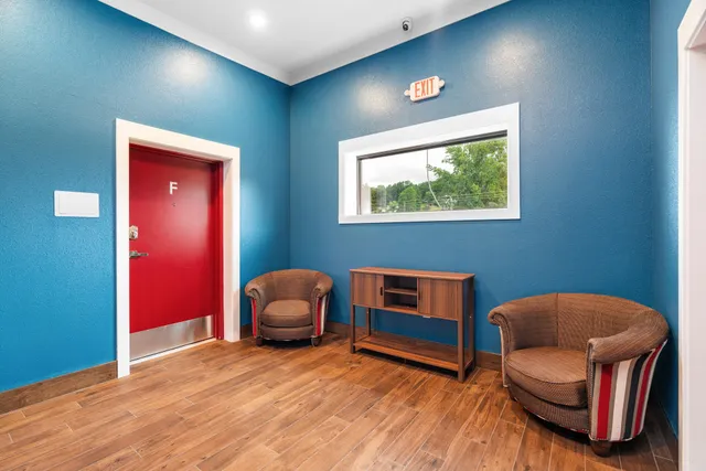 a view of a bedroom from a hallway