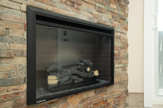 a bathroom with a granite countertop sink toilet and mirror