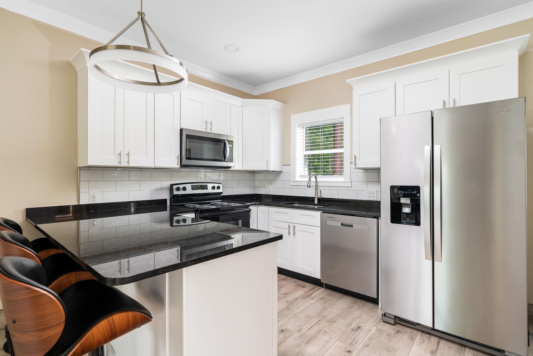123 Englewood Road Athens, TN 37303 - Photo 38 of 62 a kitchen with stainless steel appliances granite countertop a refrigerator a stove a sink and a microwave