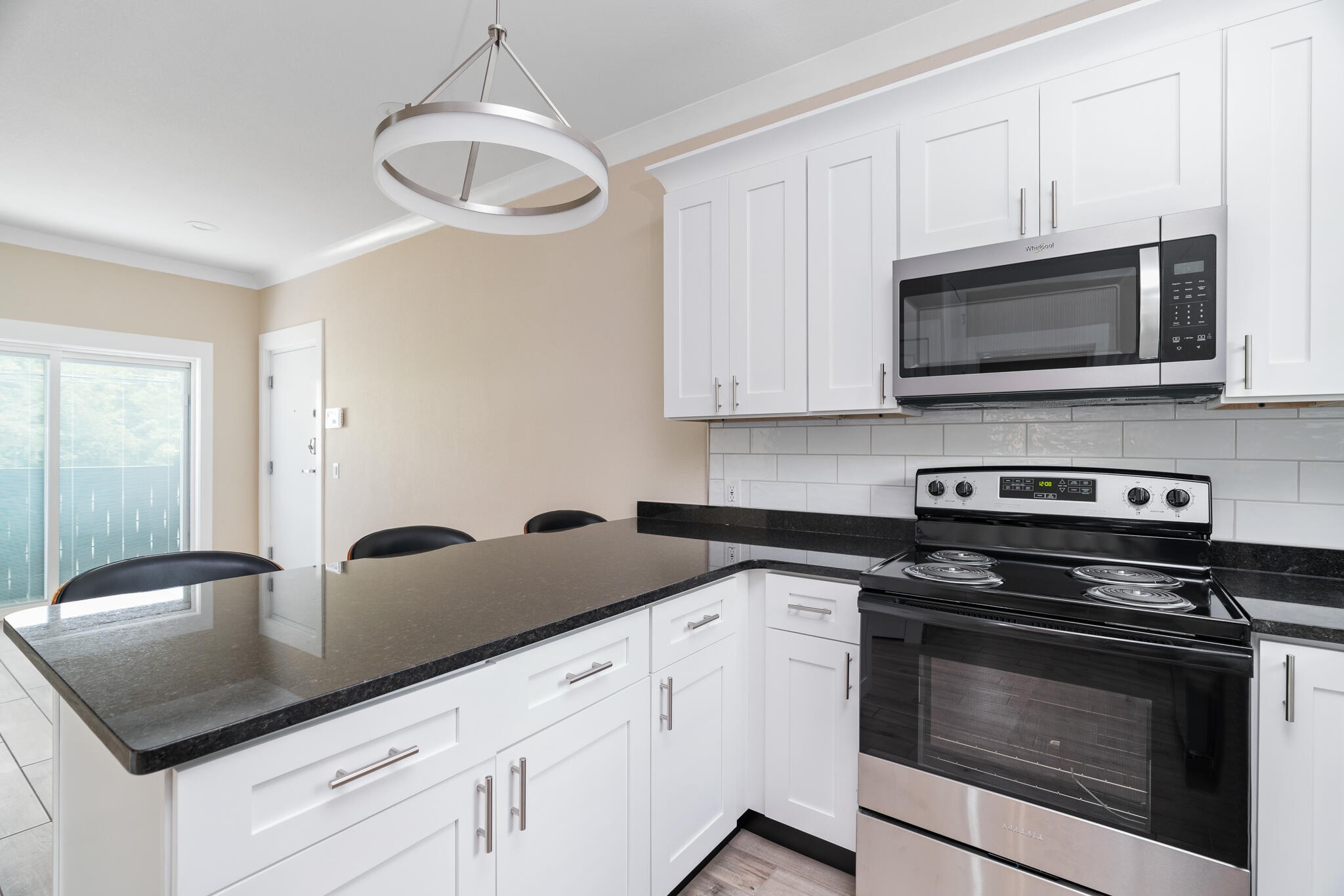 123 Englewood Road Athens, TN 37303 - Photo 40 of 62 a kitchen with stainless steel appliances granite countertop a sink dishwasher a stove microwave and oven with white cabinets