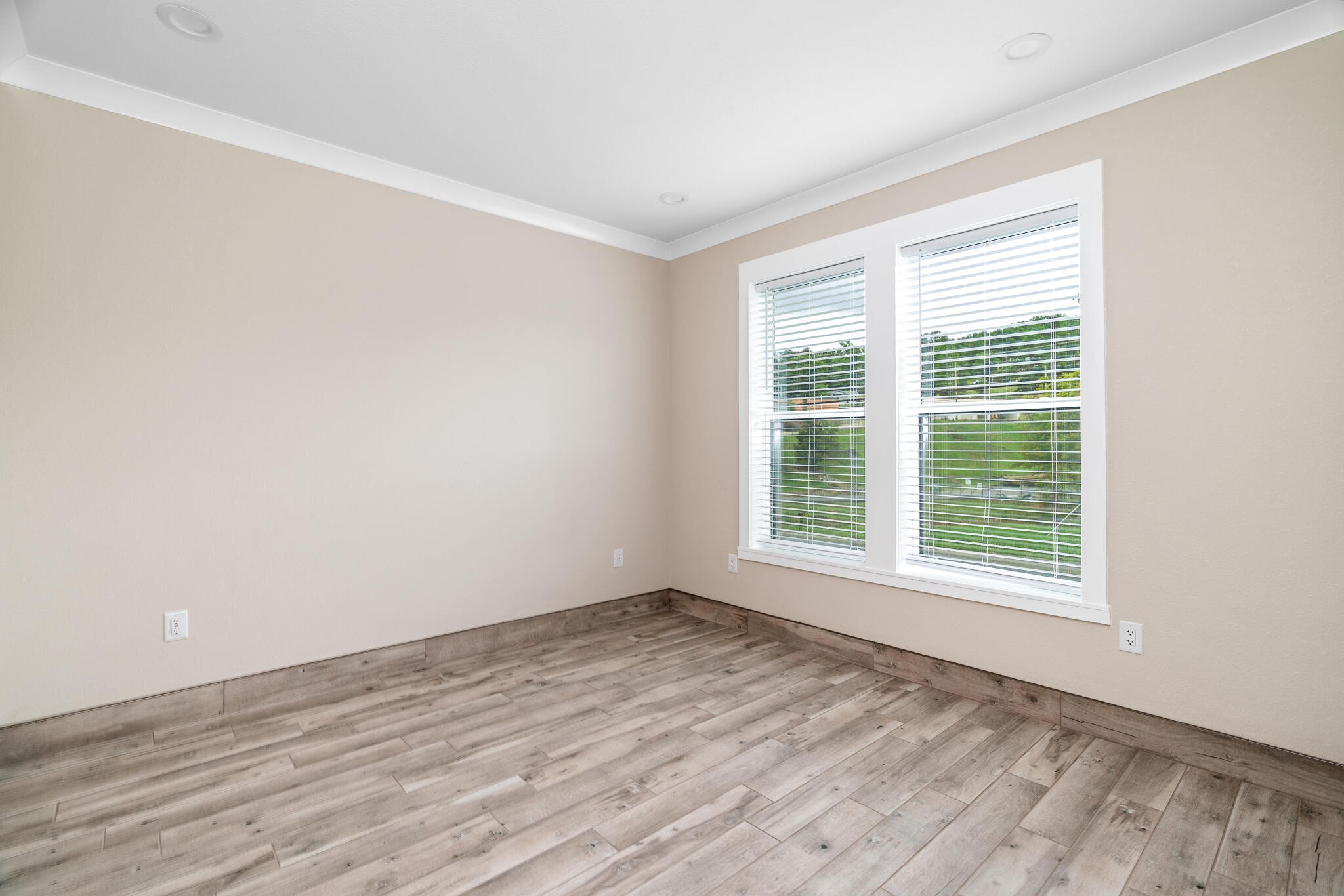 123 Englewood Road Athens, TN 37303 - Photo 42 of 62 a view of an empty room with wooden floor and a window