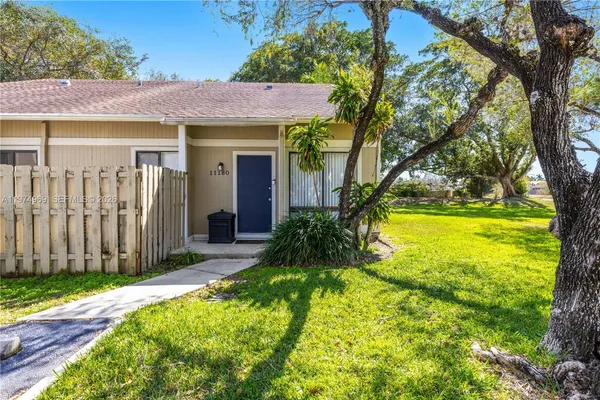 a view of a house with a yard