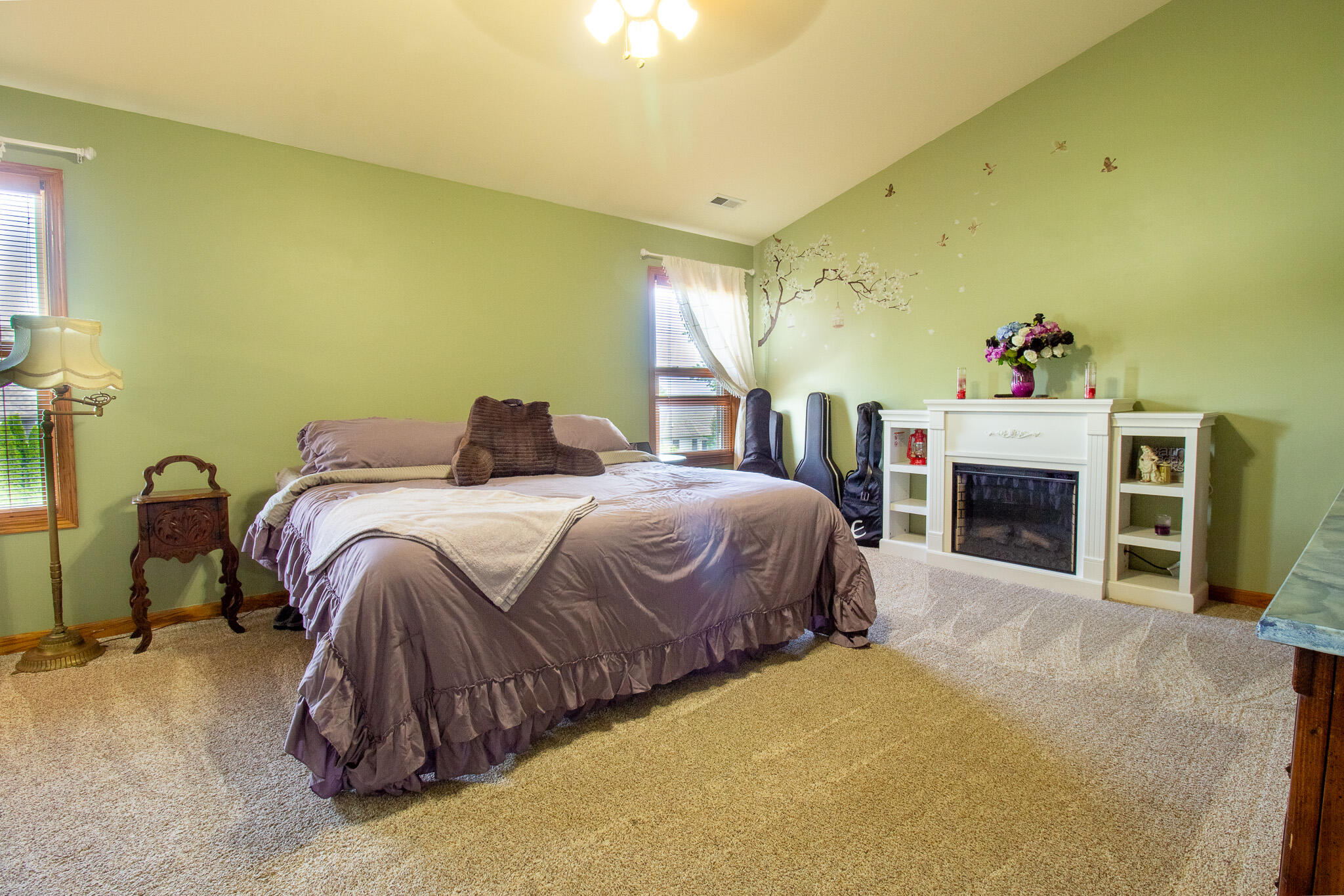 2550 Honelee Court Valparaiso, IN 46385 - Photo 19 of 37 a bedroom with a bed and a fireplace
