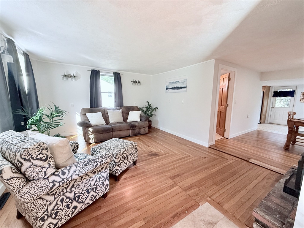 975 South Main Street Bellingham, MA 02019 - Photo 4 of 38 a bedroom with furniture and a wooden floor