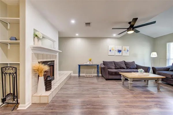 a living room with furniture and a fireplace