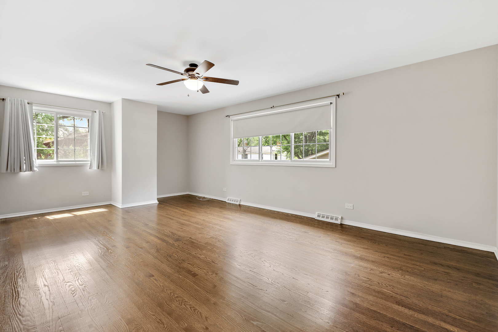 1524 Pfingsten Road Glenview, IL 60025 - Photo 14 of 26 a view of an empty room with wooden floor and a window