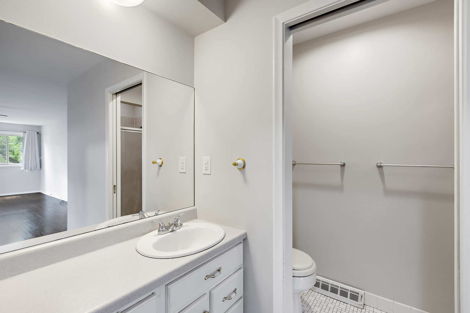 1524 Pfingsten Road Glenview, IL 60025 - Photo 16 of 26 a bathroom with a granite countertop sink toilet and shower