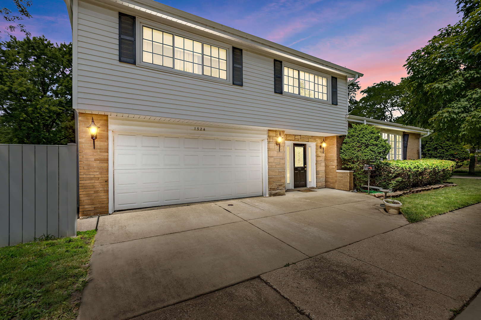 1524 Pfingsten Road Glenview, IL 60025 - Photo 2 of 26 a front view of a house with garden