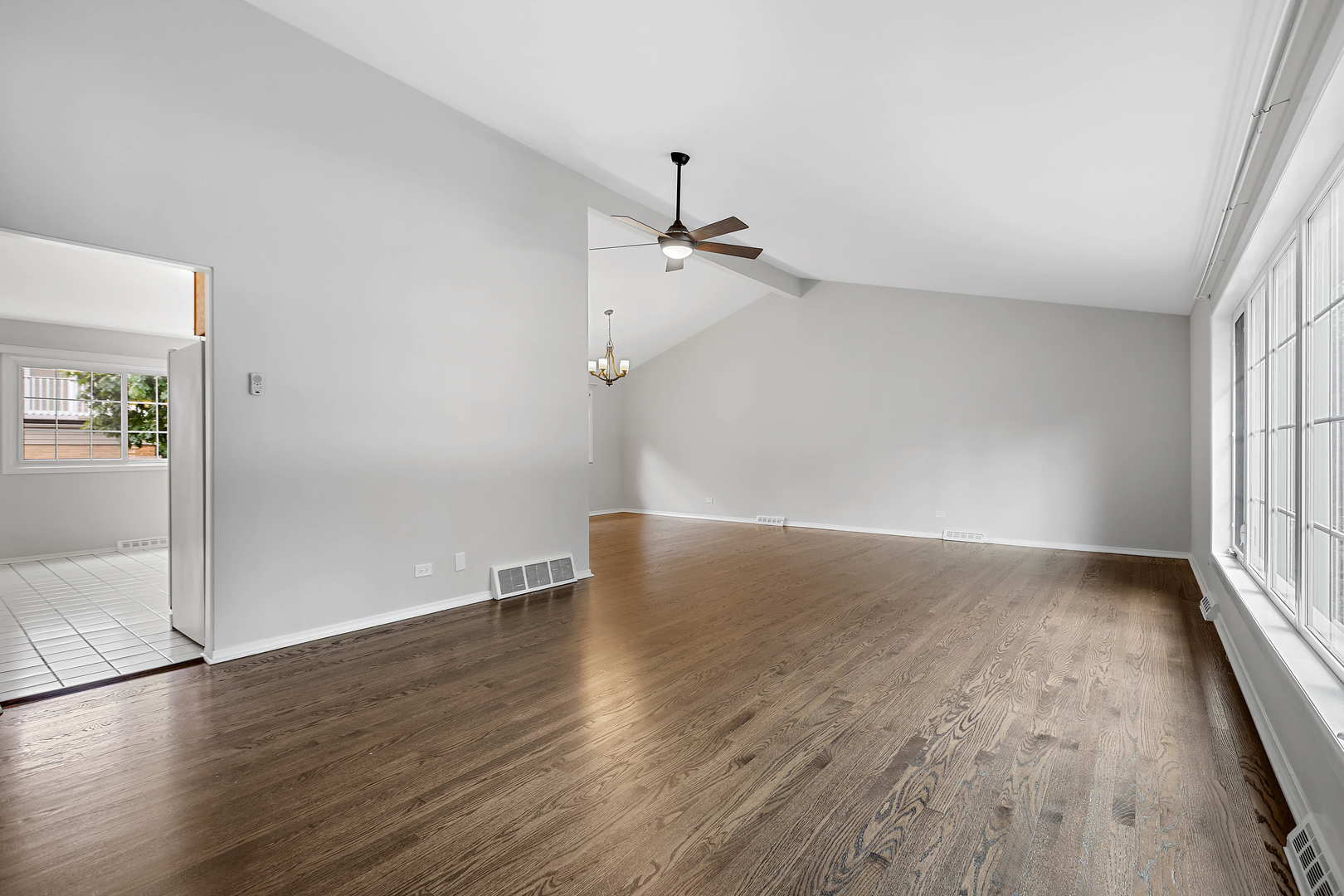 1524 Pfingsten Road Glenview, IL 60025 - Photo 4 of 26 an empty room with wooden floor and windows