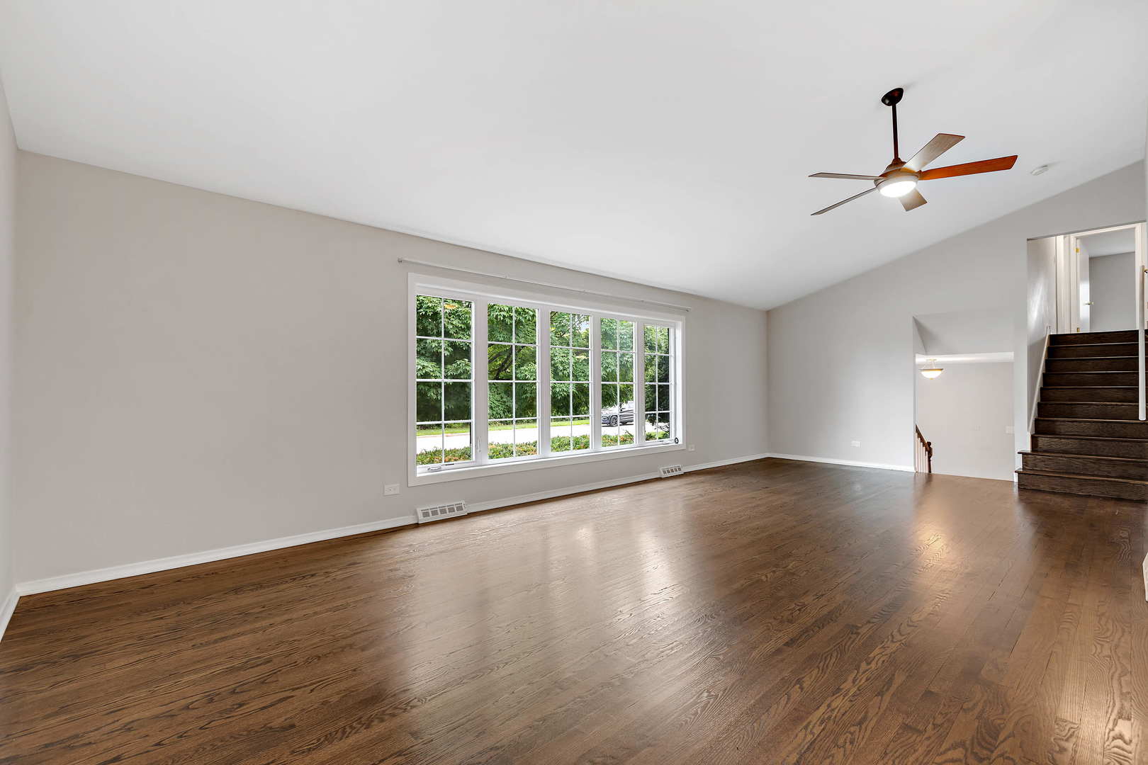 1524 Pfingsten Road Glenview, IL 60025 - Photo 5 of 26 a view of empty room with wooden floor and fan