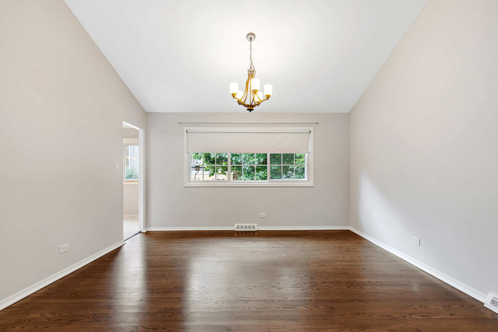 1524 Pfingsten Road Glenview, IL 60025 - Photo 7 of 26 an empty room with wooden floor and windows