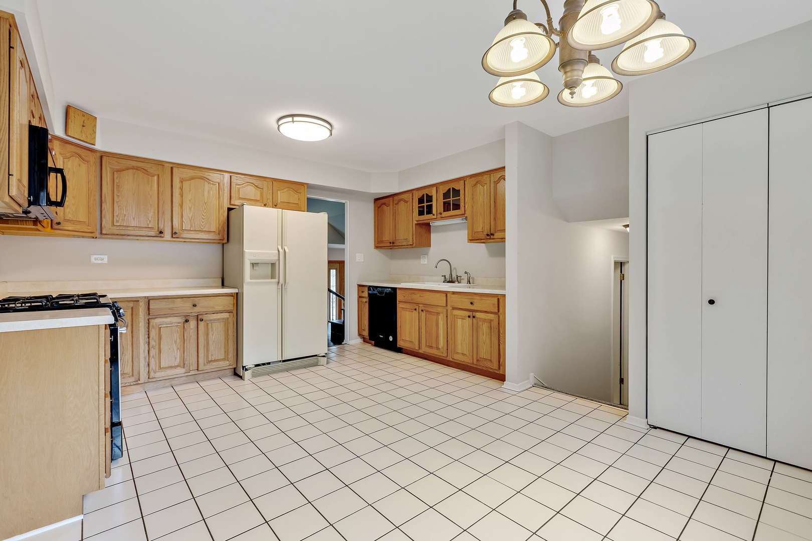 1524 Pfingsten Road Glenview, IL 60025 - Photo 8 of 26 a kitchen with cabinets and stainless steel appliances