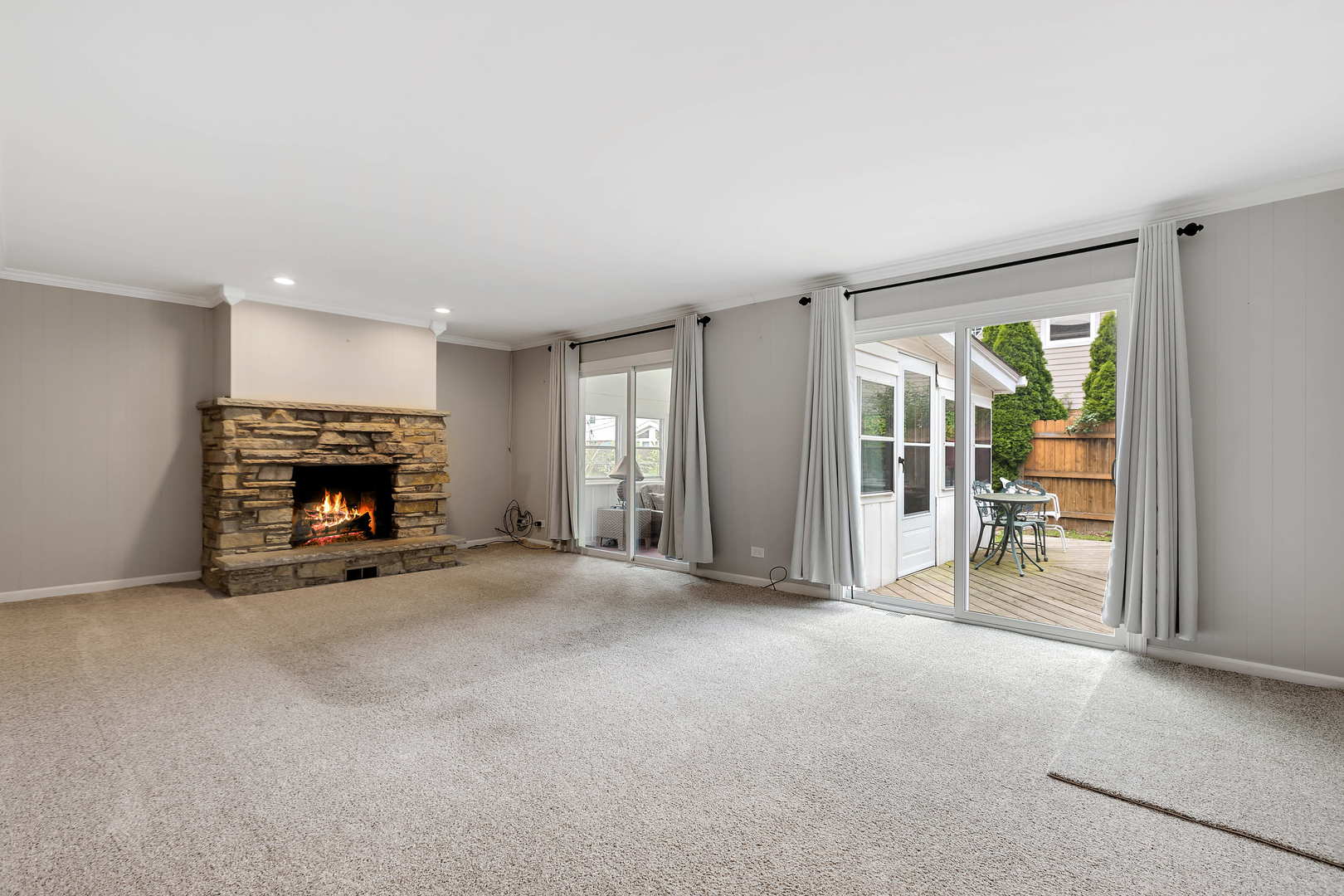1524 Pfingsten Road Glenview, IL 60025 - Photo 10 of 26 an empty room with furniture and a fireplace