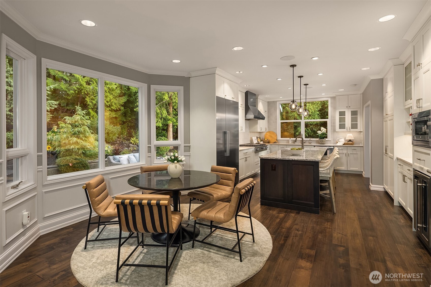 17620 Southeast 106th Street Renton, WA 98059 - Photo 17 of 40 a dining room with furniture a large window and wooden floor