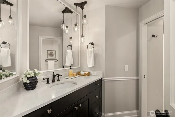 a kitchen with stainless steel appliances granite countertop a sink and a microwave