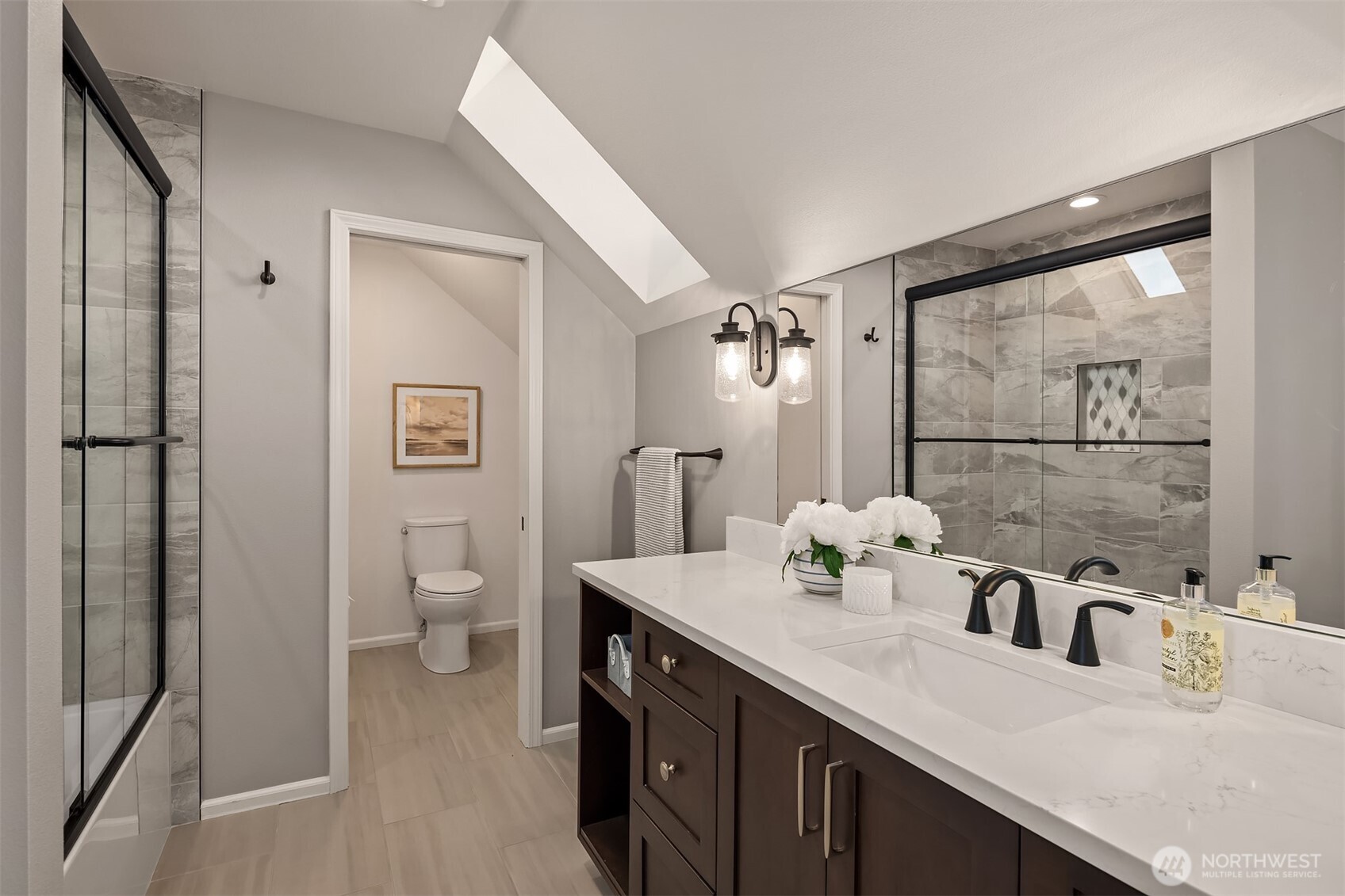 17620 Southeast 106th Street Renton, WA 98059 - Photo 27 of 40 a bathroom with a sink vanity granite and toilet
