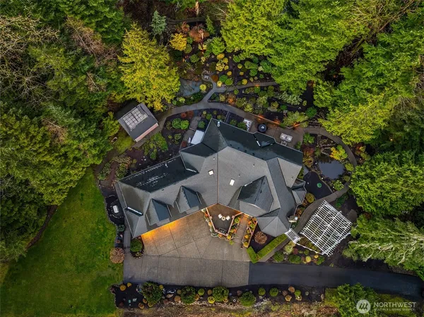 an aerial view of a house with a yard