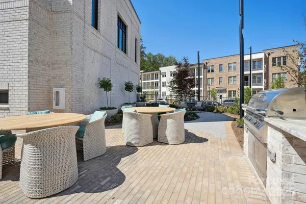 a view of a swimming pool with outdoor seating