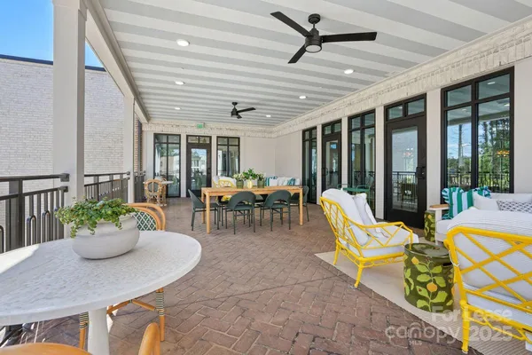 a outdoor dining space with furniture and garden view