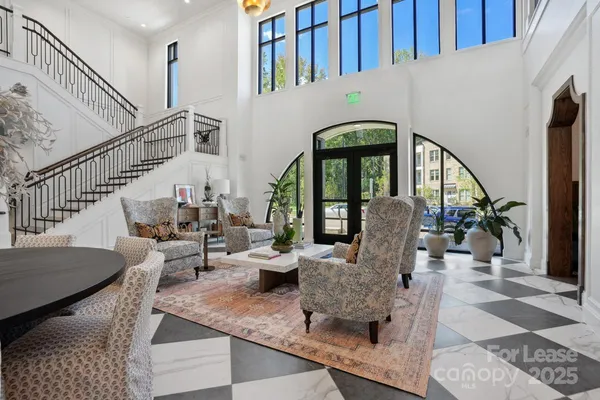a view of hall way with furniture