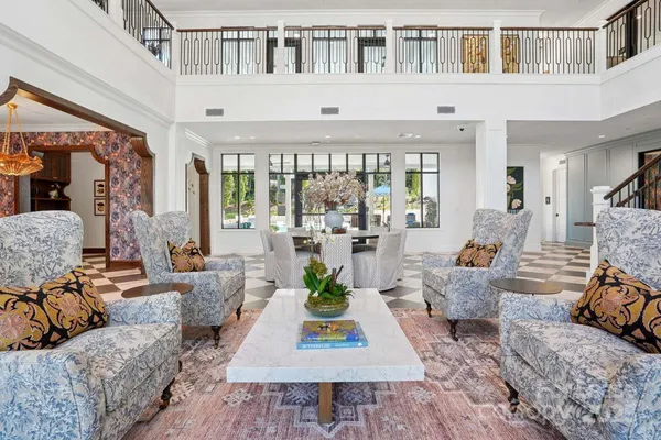 a living room with furniture or couch and a large window