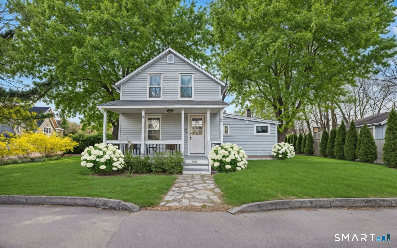 53 Maple Street Darien, CT 06820 - Photo 1 of 33 Design note - we added in the white hydrangeas and a curved live edge border for visual impact.
