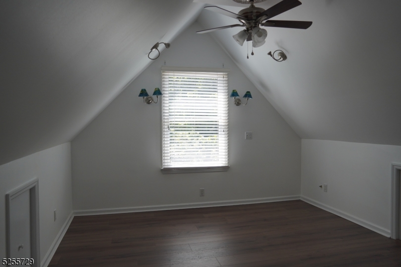 96 High Street Newton, NJ 07860 - Photo 13 of 26 an empty room with wooden floor fan and windows