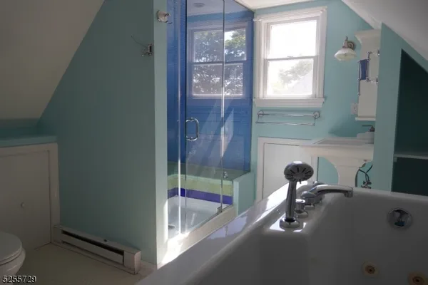 a bathroom with a bathtub and shower