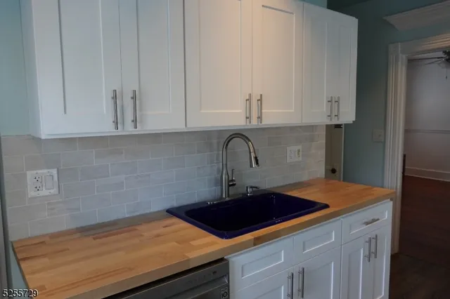 a kitchen with a sink and cabinets